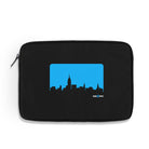 an image with a white background of a black 16" neoprene sleeve with a blue new york city skyline graphic as well as a white and blue SVA logo that reads "SVA NYC"